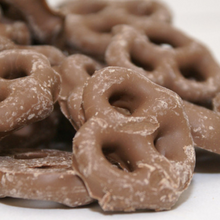 Chocolate-covered pretzels on a white background