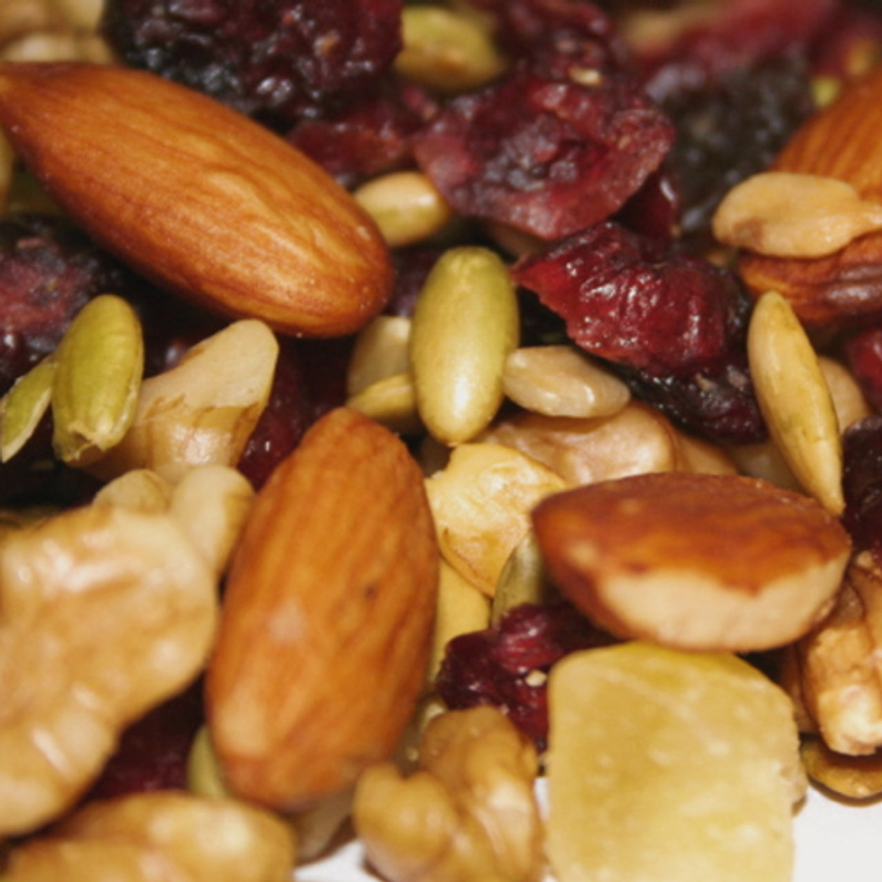 Close-up of Klein Bros Cranberry trail mix with nuts and dried cranberries.