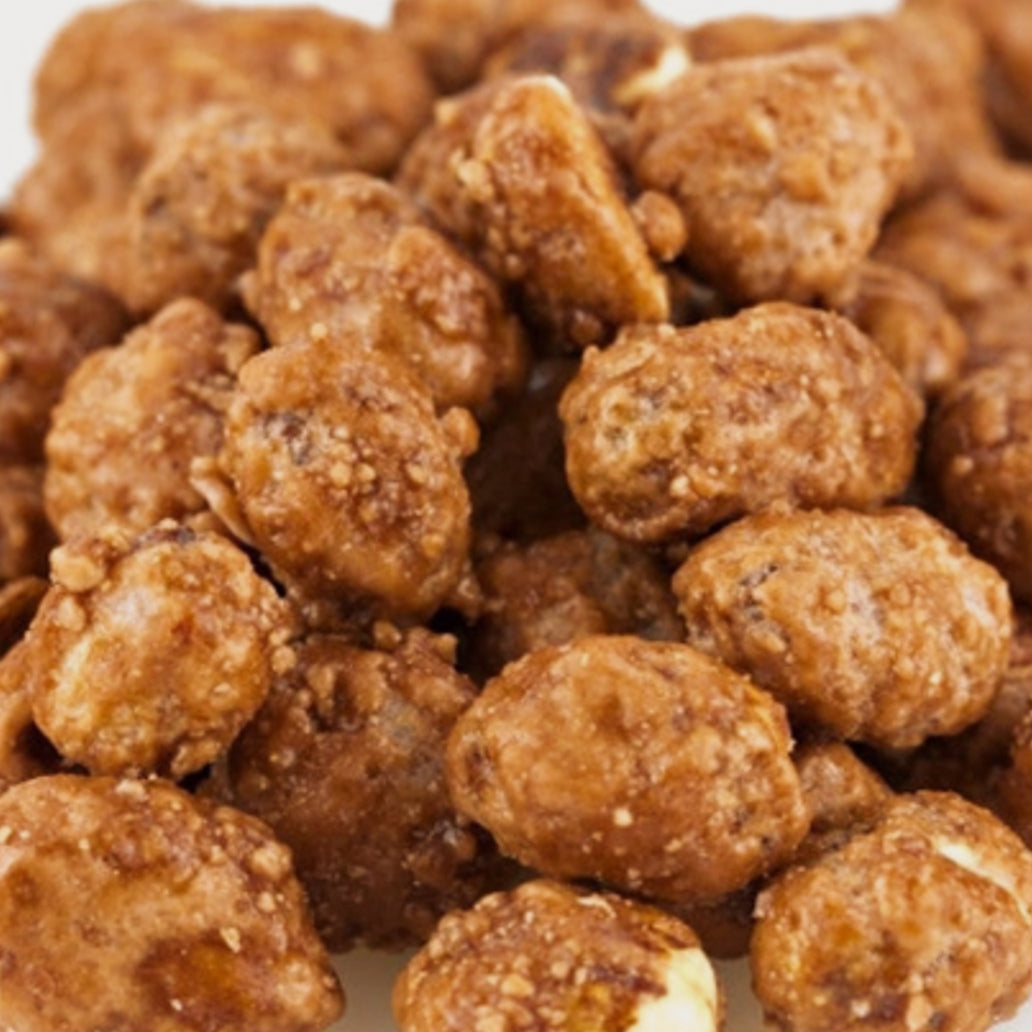 Close-up of roasted peanuts on a white background
