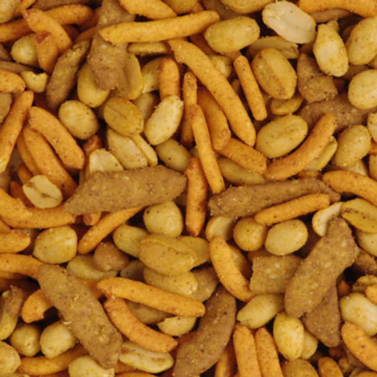 Assorted pet food颗粒s including orange, brown, and beige colors.