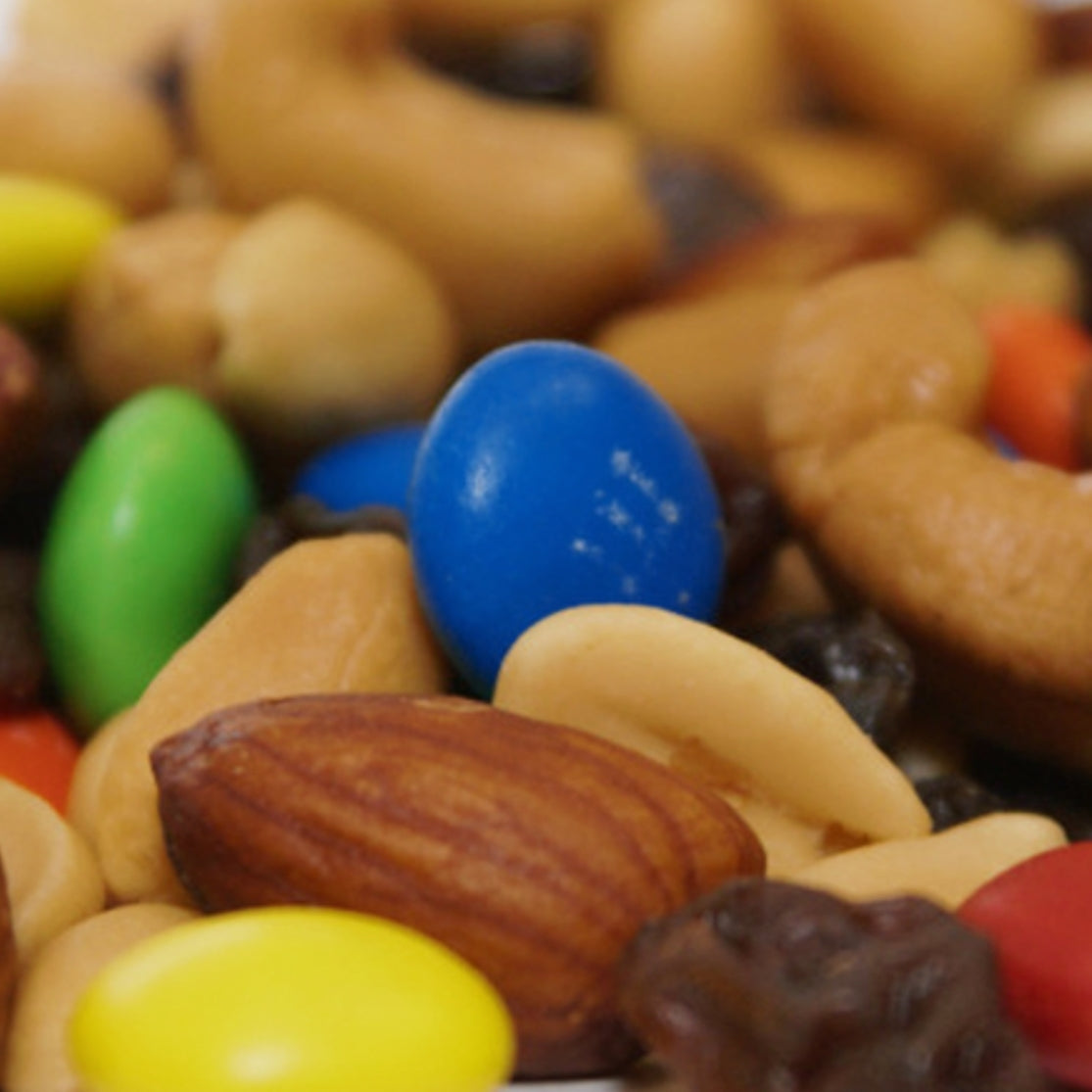 Assorted nuts and colorful candies in a close-up shot