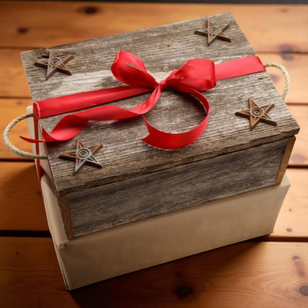 Wooden gift box with a red ribbon and star decorations on a wooden surface